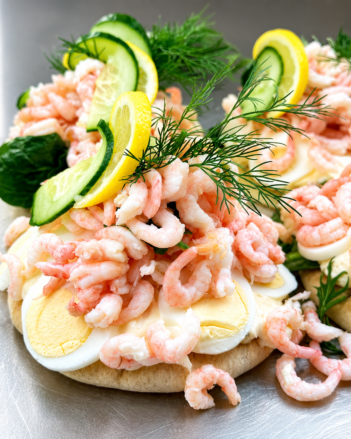 Open-faced shrimp and egg sandwich with dill and lemon