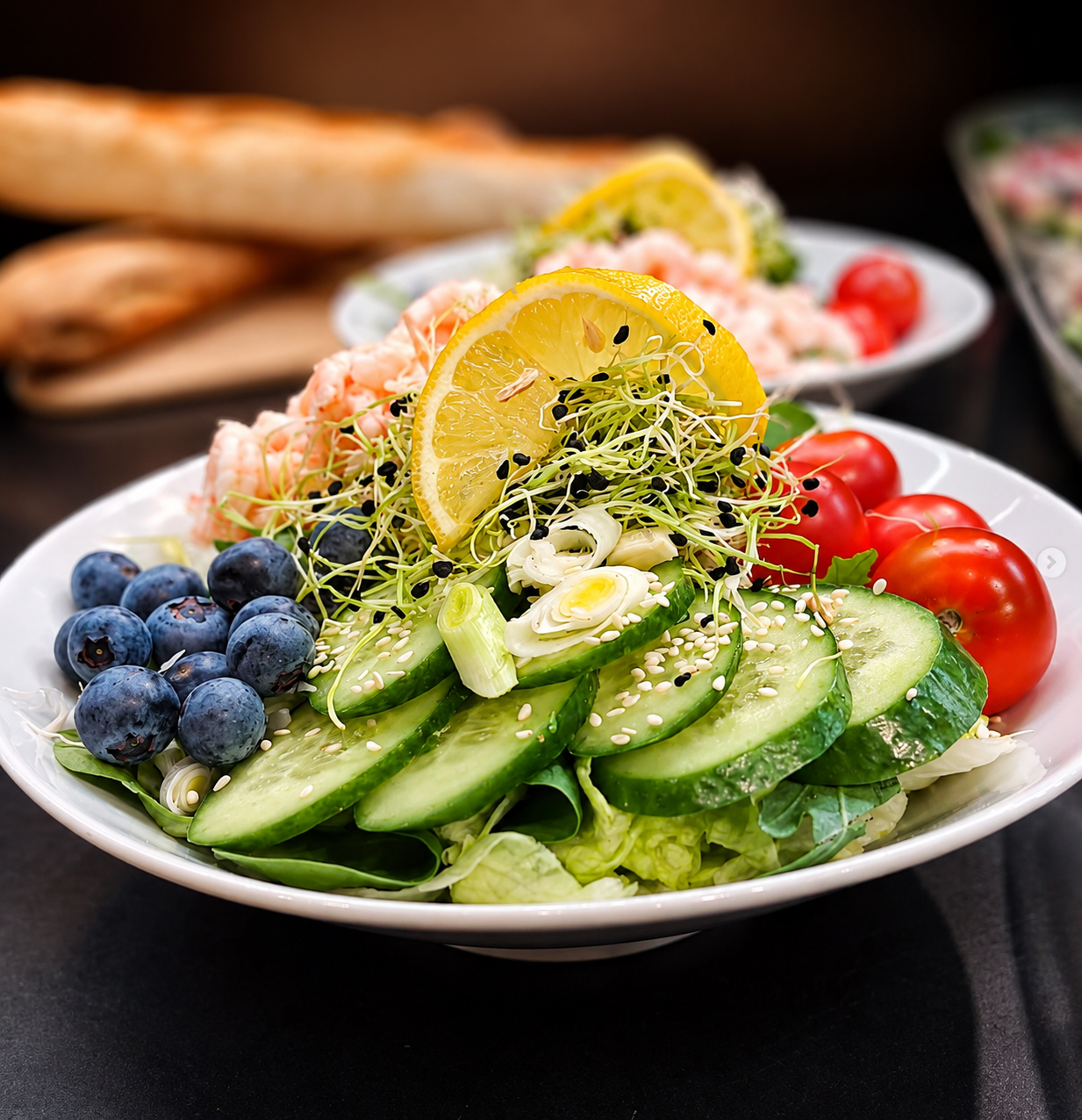 Fresh shrimp salad with lemon, cucumber, and blueberries at Spisa